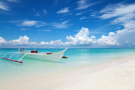 white boat on tropical bantayan island in philippines